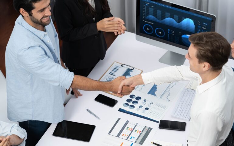 cherrywork_Group of diverse office worker employee shake hand and working together Prudent