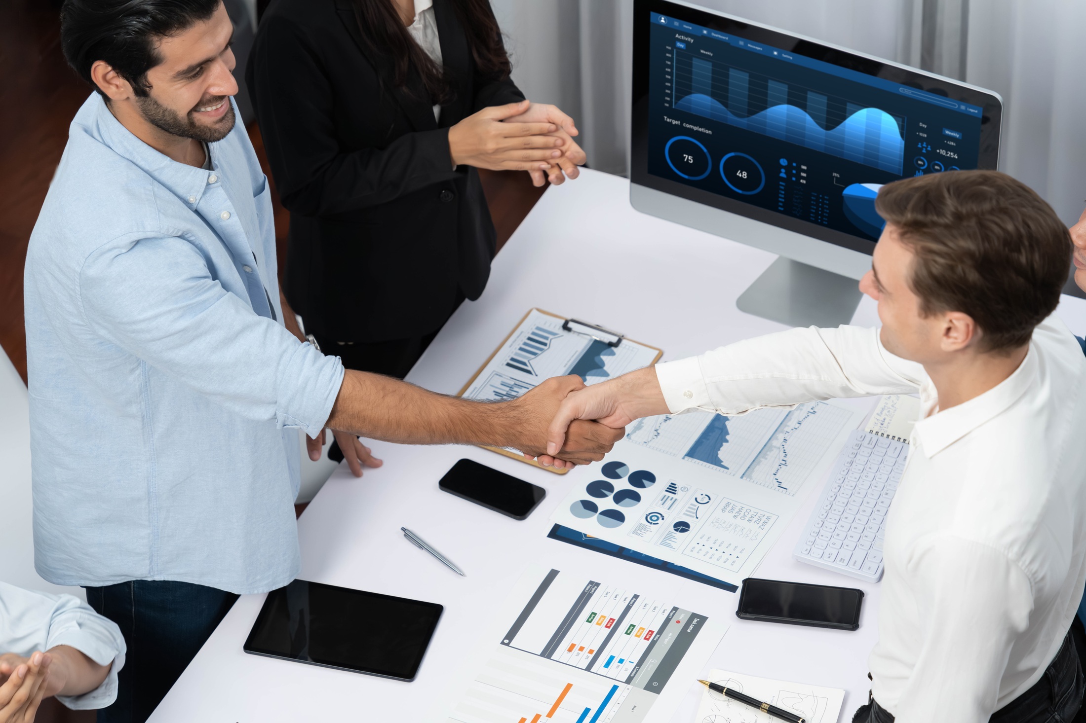 cherrywork_Group of diverse office worker employee shake hand and working together Prudent